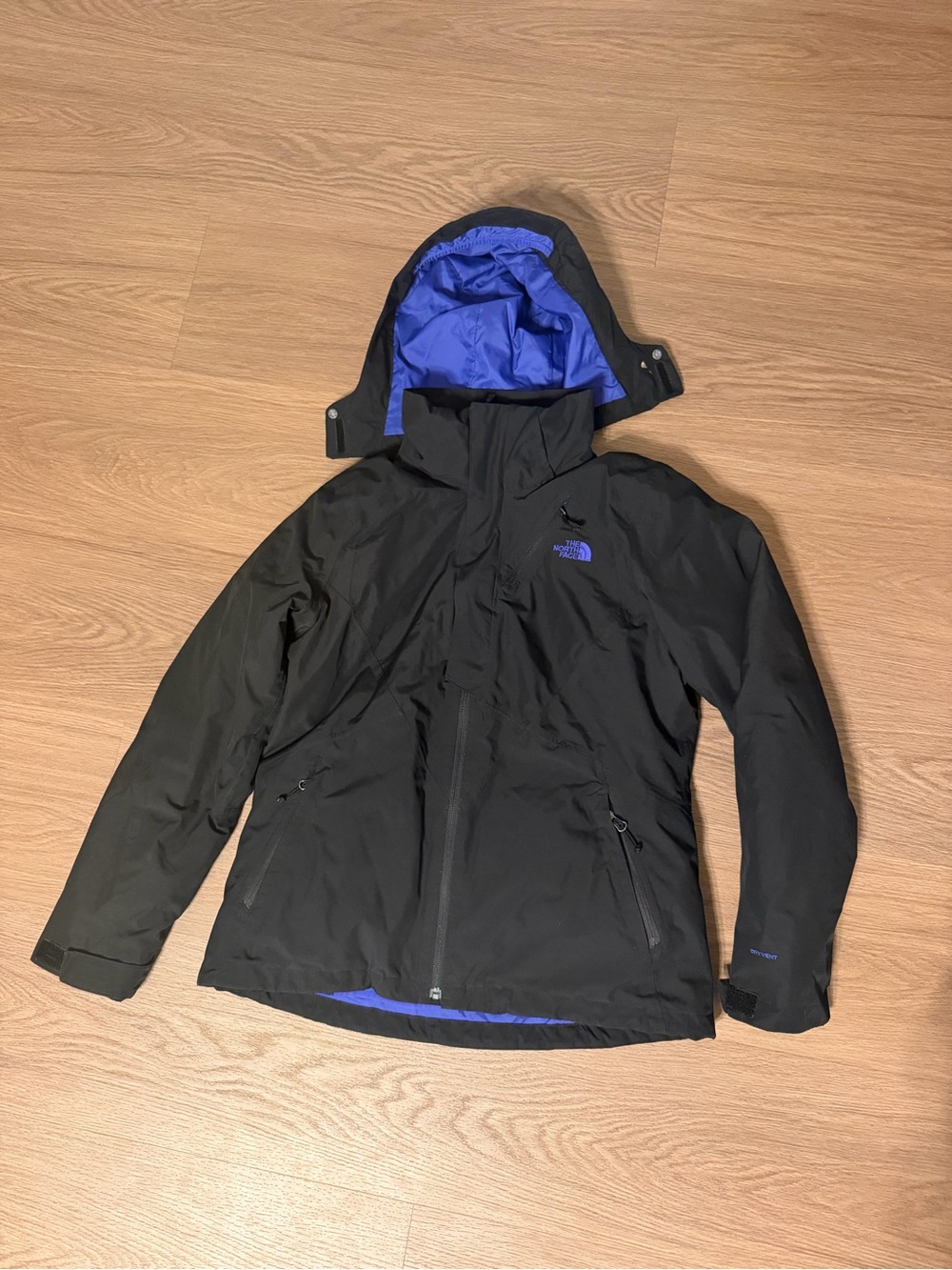 The North Face Women’s Black Jacket with Purple Logo Accent